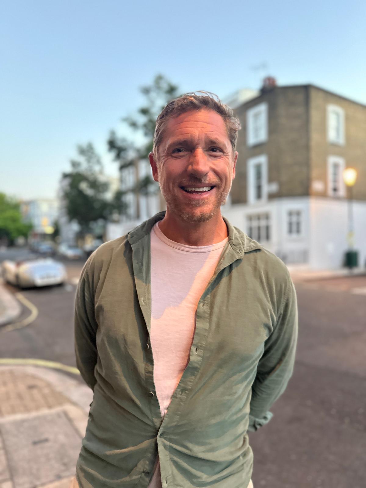 Gibson, smiling, on a London street
